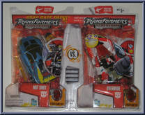 Hot Shot vs. Override from Transformers - Cybertron - Deluxe Class manufactured by Hasbro [Front]